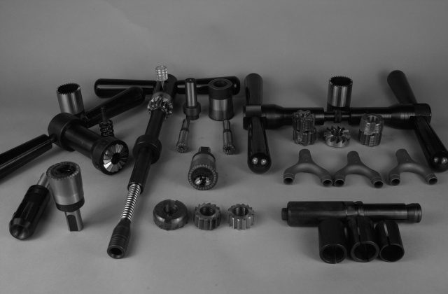LAN71 Tool Assemblage.  All tools aside from the Marchetti bottom bracket taps are designed and machined in the Strawberry workshop.  The cutters are blanked out, heat treated and then precision ground in Portland.  All grinding is performed by McKenzie Tool Grinding in Portland.  The wishbone castings are a Strawberry design and the castings are manufactured by Long Shen in Taiwan.  The photo displays bottom bracket tapping and facing holders, head tube ream and face holder, integral and back threaded HSS tube mitre cutters, wishbone investment castings, lug vise, various reamers, taps and facers.