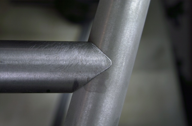 Photo of top tube/seat tube joint of a customer's frame.  This perfectly mitred joint is the first to be done with the new brazed carbide mitre cutter turned out in the Strawberry workshop and precision ground by McKenzie Tool Grinding Service here in Portland.  A precisely mitred joint calls for a precision mitre cutter.  No hole saws used in the Strawberry workshop!