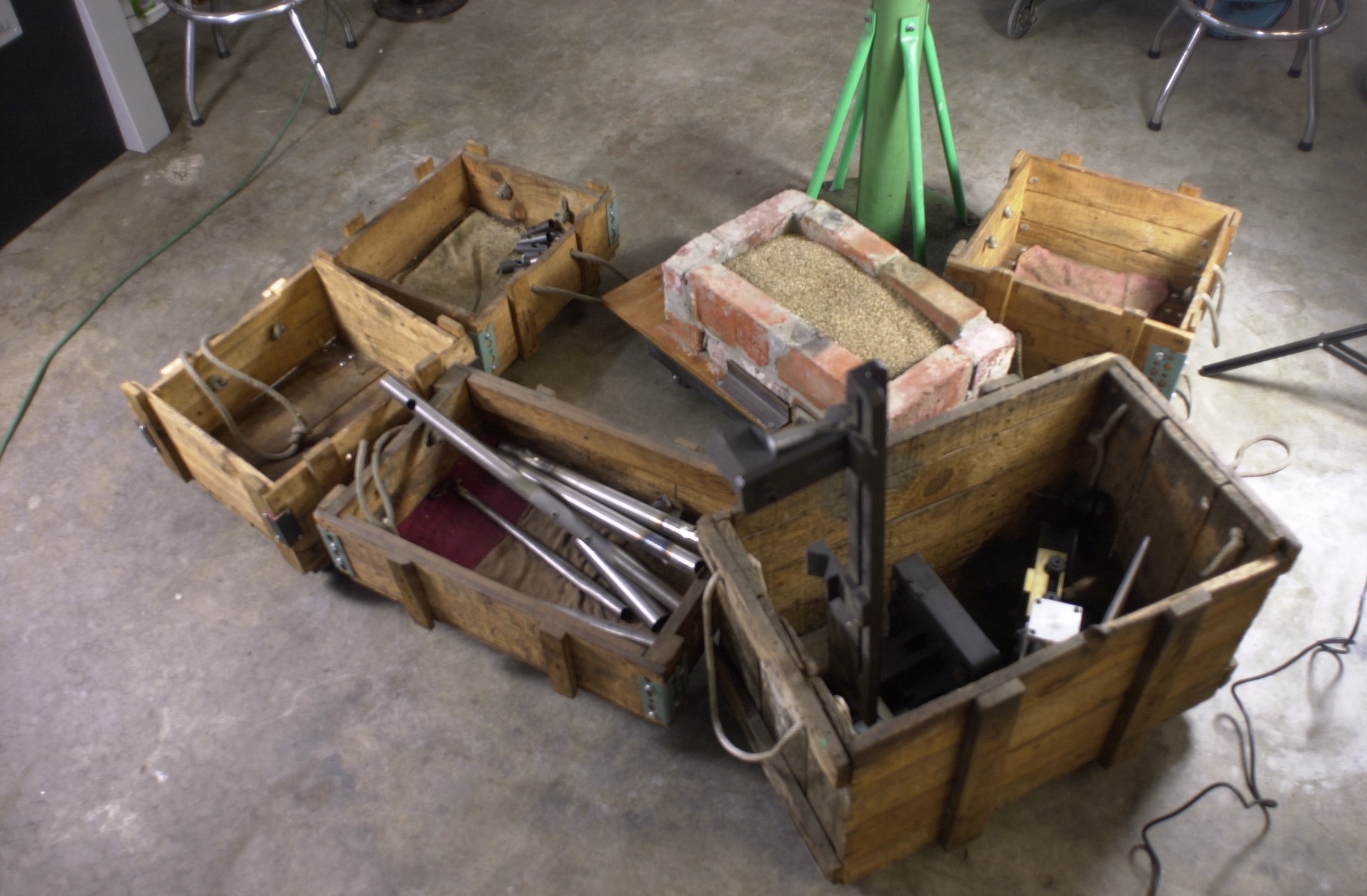 Six rolling carts.  Some hold fixtures, others hold tubes soon to become a frame and others hold lathe/mill projects in various stages of completion.  The latest is the brazed carbide mitre cutter brick cooling cart filled with vermiculite.  Now if only I had elves to help while I am sleeping.