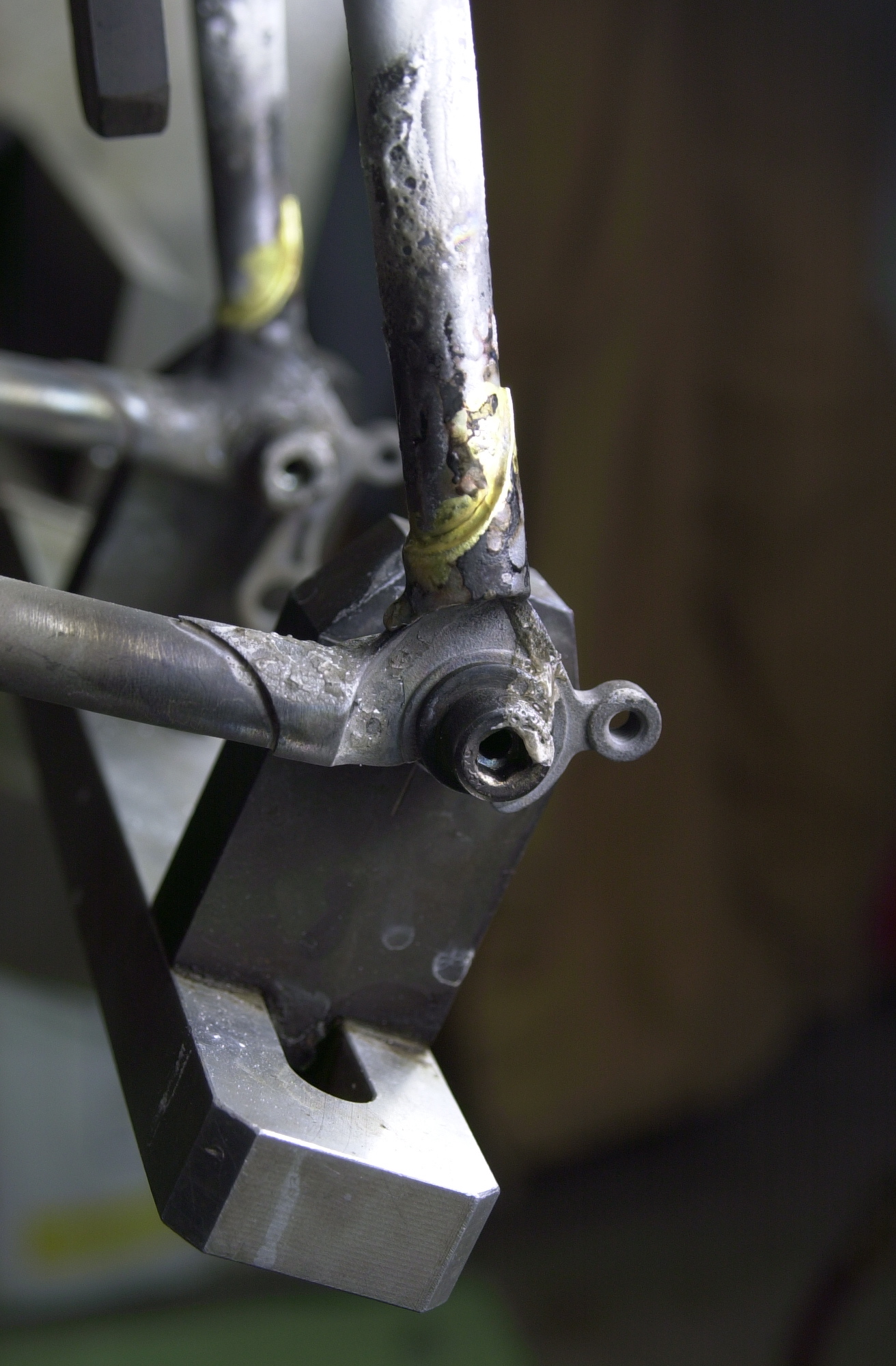Closeup of the brass brazed seatstay/dropout joint.