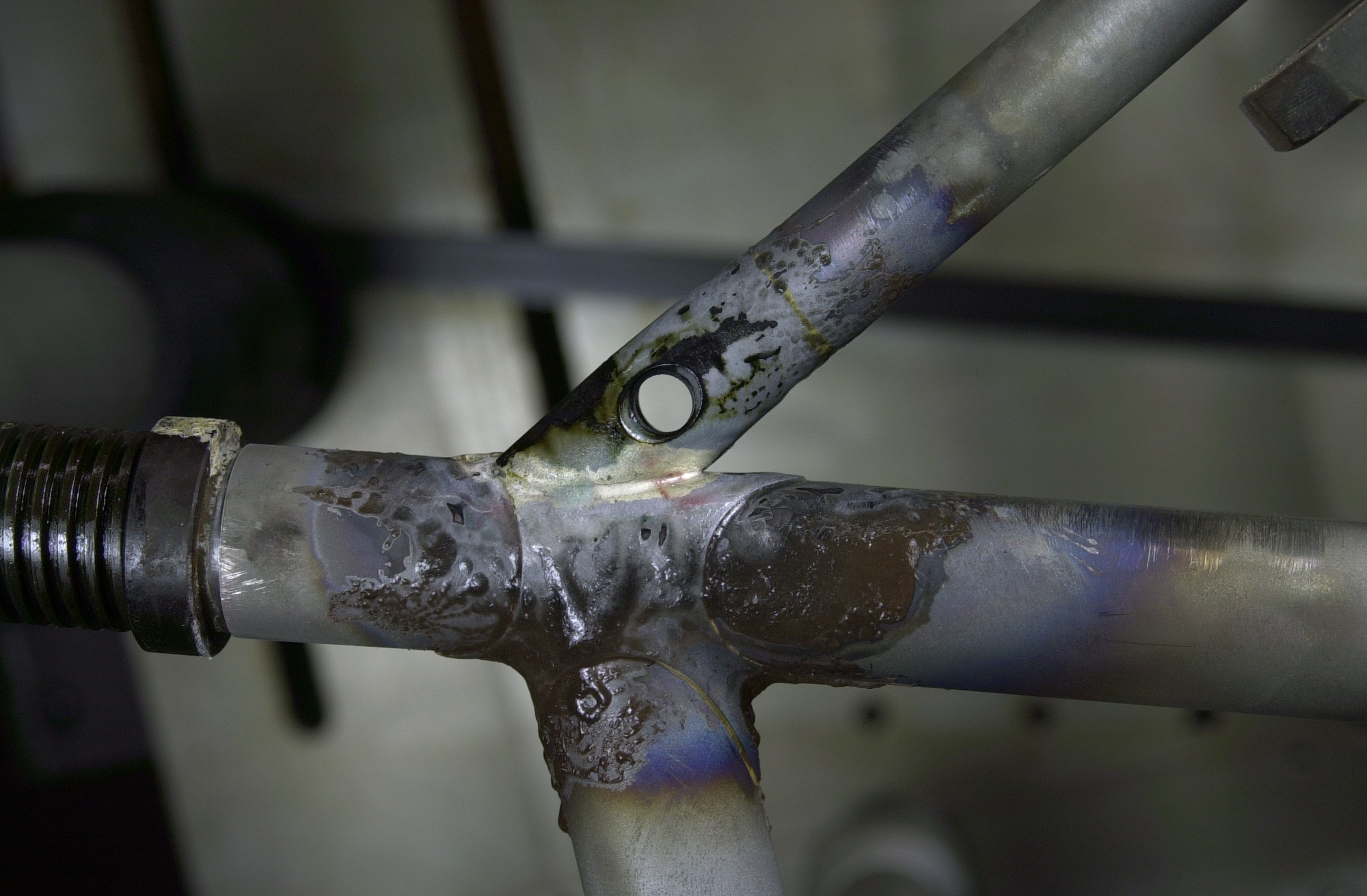 The wishbone topstay binder was previously brass brazed using a preform ring placed inside the 19mm topstay tube.  This photo shows the silver brazing of the topstay binder to the rear of the seat lug.  The binder itself is milled from a piece of 4130 round stock and mitred with a 31mm mitre cutter to match the diameter of the seat lug at the angle of the seat tube/topstay joint.