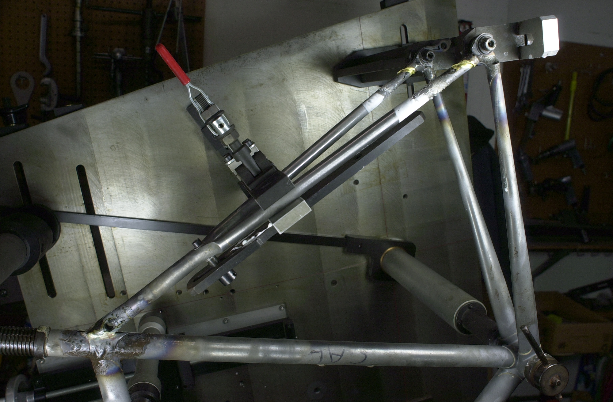Another photo of the wishbone rear triangle showing the alignment clamp and the dropout clamps.  Once the topstay binder is silver brazed to the rear of the seat lug the seatstay tips are brass brazed into the Llewellyn cast dropouts.