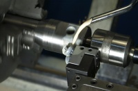 Cut Knurling with the Accu-Trak knurling tool.  Cut knurling works so much better than form rolling.