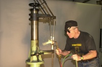 Moving over to the right hand seatstay and playing the flame primarily on the casting base rather than the thinner seatstay.  As the casting glows red the heat is progressively applied to the stay and the brass ring quickly melts bonding the stay to the cast wishbone.  Easier done than said.