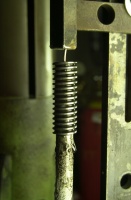 lug vise mod. Part way through the heating process.  Note that the preform is beginning to sag and will soon become one with the steel.  Harris heating torch handle no. 43-2, "F" low pressure injector mixer no. B-43-N ("E" positive pressure mixer has also been used - can't tell the difference in performance personally), 10-1/2" bent heating tip tube no. 2393-4F and heating tip no. 2290-1H with a 103,000 BTU output running oxy/propane is used to cook with.