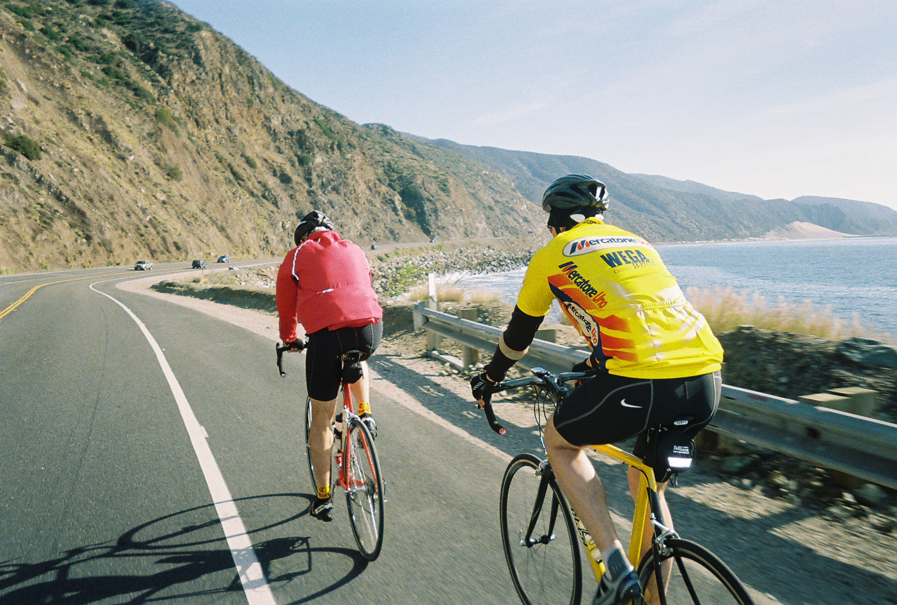 2006 SB Bike trip. Another pic of Dave and friend riding along the coast north of Santa Barbara.  Note: buddy has just about dropped off Dave's wheel.  That S-----a bike just can't keep up with a Strawberry.