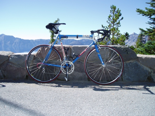 2007 Cycle Oregon.  My new bike somewhere along Crater Lake Rim Drive.  650C wheels, 73 degree head angle, 40mm. fork offset, 51cm seat x 54 top tube, 26cm b.b. height (thereabouts), 39.6cm. chainstays. Worked good, felt stable, now if only I could find some form.