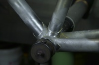 Detail of bottom bracket shell during pre-brazing fit-up check of frame no. 7018.  Sub-assembly of bottom bracket shell brazed up with chainstays and seat tube has previously been completed and returned to the frame fixture for fit-up to main diamond tubes (top, head and bottom tube).