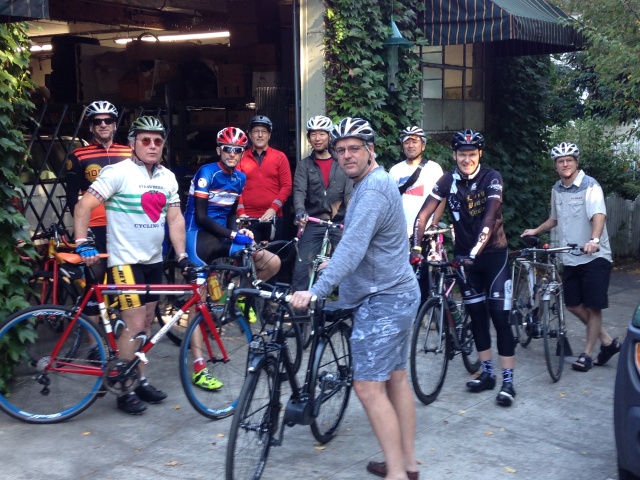 Photo taken outside the Strawberry Garage of Sunday morning framebuilder ride at the 8th. annual Handmade Bike and Beer Festival.  We rode up into the West Hills on a beautiful morning.  I had a flat on the descent but did not hit the pavement.  The cyclists include from left:  Dave/Mjolnir Cycles, Puyallup, WA; Andy/Strawberry Bicycle, Portland, OR; Greg/Magic Cycle Werks, Bend, OR; Kevin/Portland Fender Co, Portland, OR; Koushou/Helavna Cycles, Tokyo, Japan; Steve/Ti Cycles, Portland, OR; Shun/East River Cycles, Tokyo, Japan; Chris/Henry James Bicycles, Portland, OR; Dave/Ti Cycles, Portland, OR.