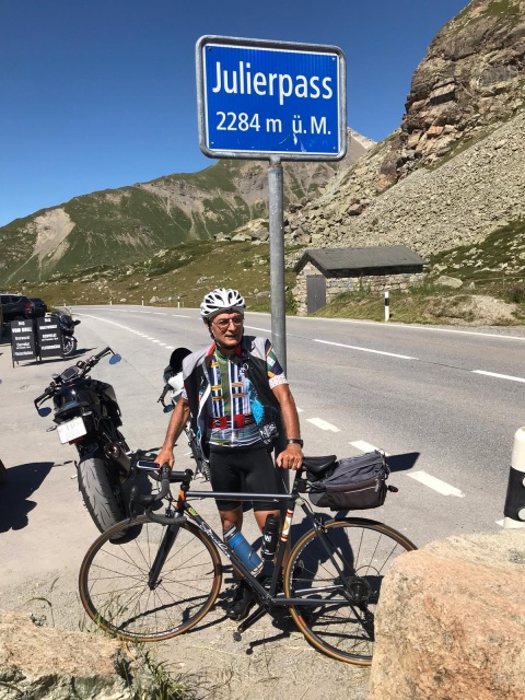 Dr. Marco summiting Julierpass, Italy on his Strawberry road bike.