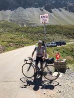 Dr. Marco summiting Albula Pass, Italy on his Strawberry road bike.