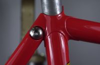 Close up of the wishbone/topstay binder seat lug cluster.  10x1.5 stainless steel button head capscrew secures the seatpost.