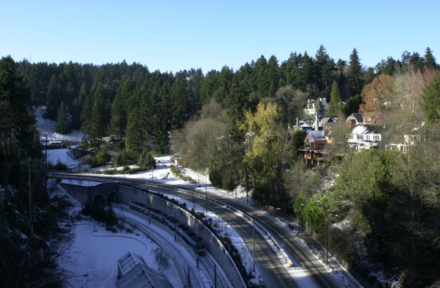 Snow day, December, 2008.  View to the west from the Vista Bridge.  MAX light rail entering the tunnel.