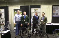 Reynolds Technology Ltd. crew (Andy Newlands, Torch and File distributor for Reynolds in USA missing (photographer)) at the 2016 NAHBS.  L to R: Ed Blessman, Metallurgical Engineer with Plymouth Tube Co; Tom Cleverly, Materials Engineer (Special Projects) with Reynolds; Paul Murphy, Production  Manager with Reynolds; Anthony Lim of Fairing.  Foreground: TI Cycles titanium bike fabricated from Reynolds butted titanium tubes and sporting the new Reynolds 3D printed disc-ready rear dropouts.