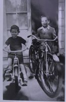 1954 my sister Ann age four perhaps on her tricycle  and me at age eight with my first bike.  Photo courtesy of the man with the hat (note the shadow by Ann's front wheel)  probably our father in front of our home on Riverwood Road, Portland, Oregon.